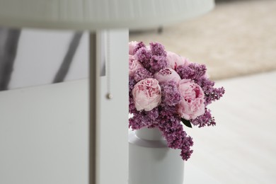 Beautiful bouquet of spring flowers in vase at home