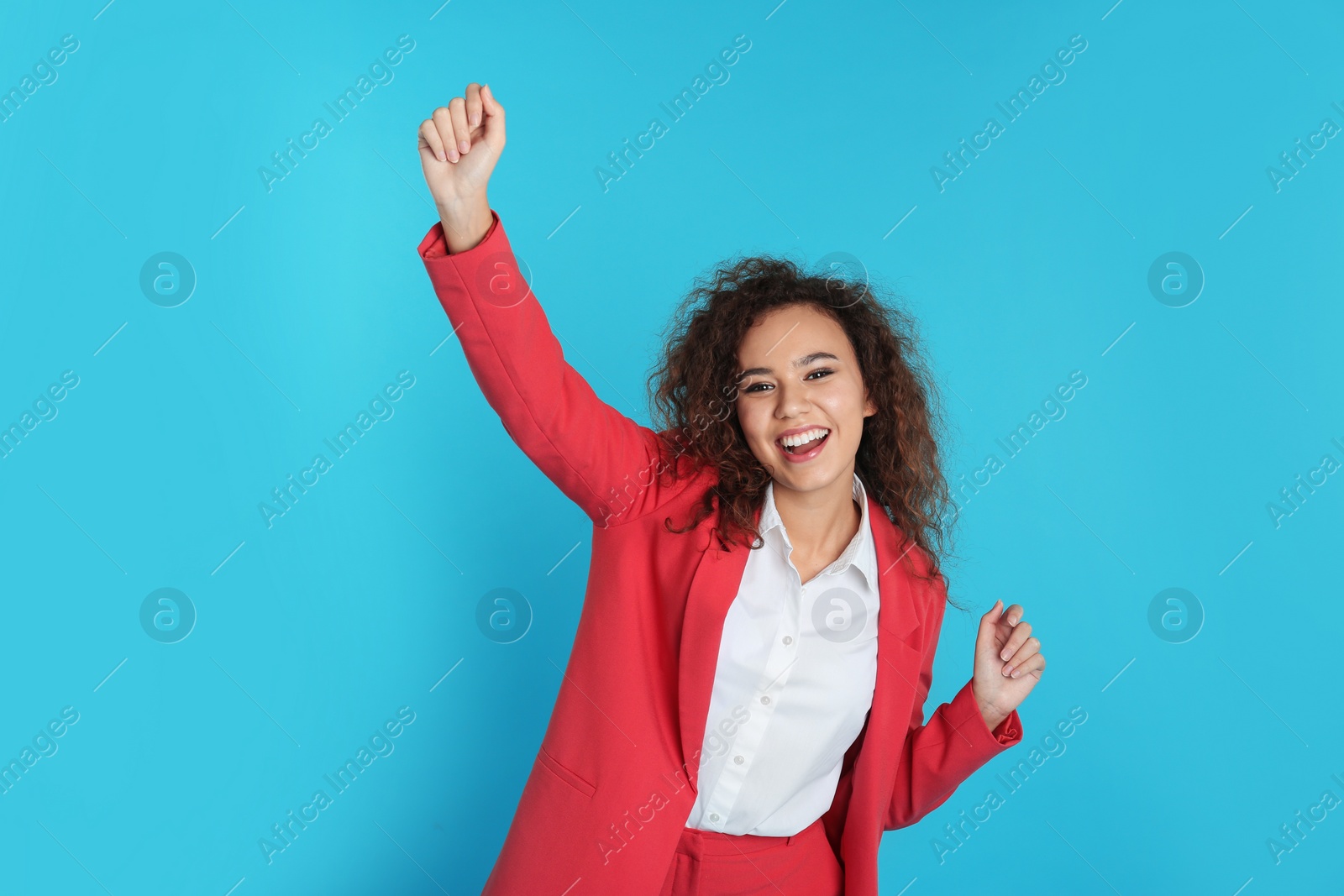 Photo of Portrait of emotional African-American businesswoman on color background