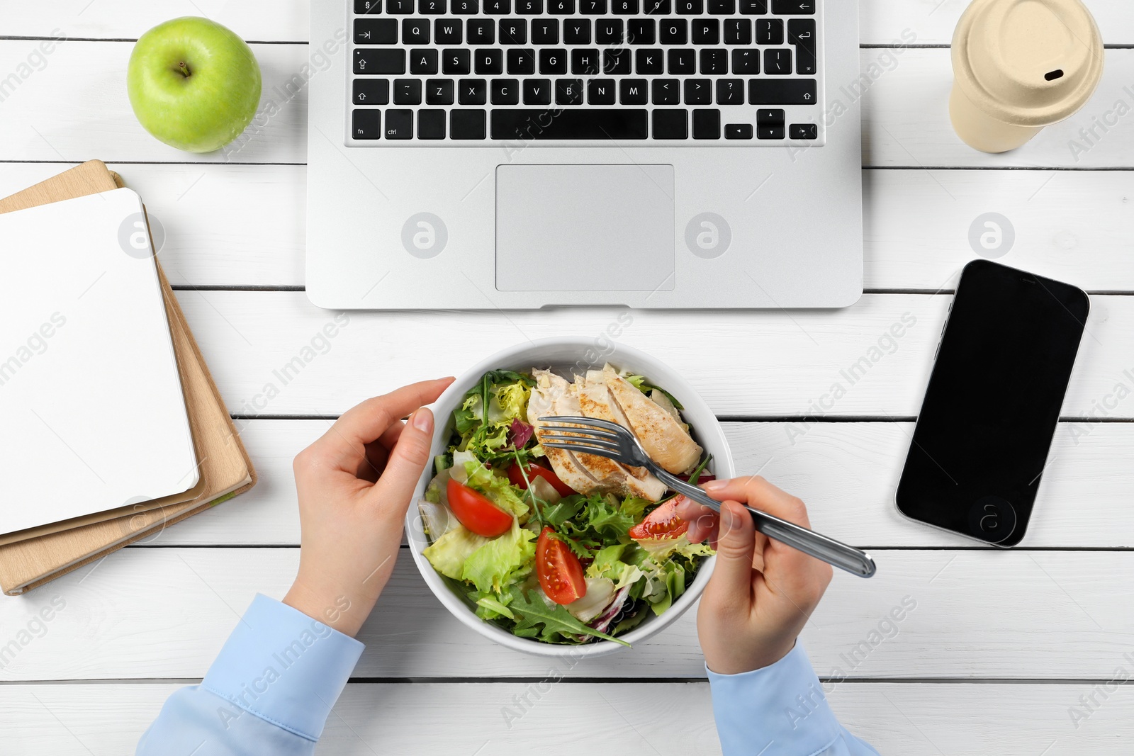 Photo of Office employee having business lunch at workplace, top view