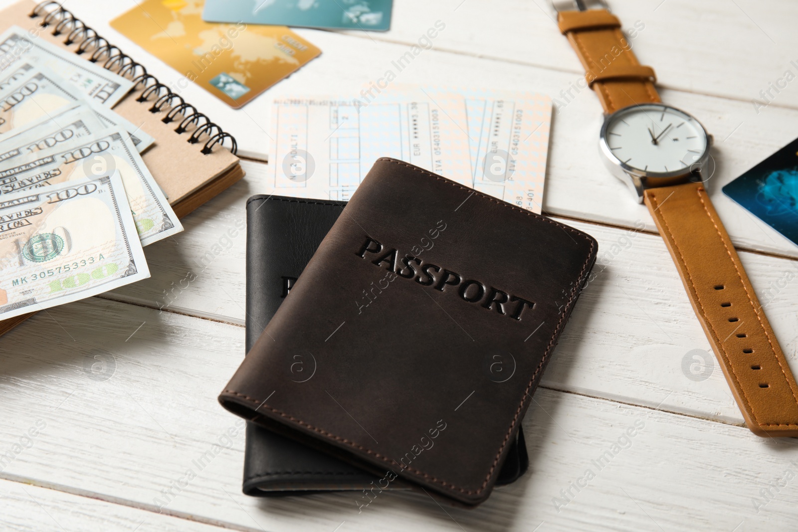 Photo of Composition with tourist items on wooden background. Travel agency