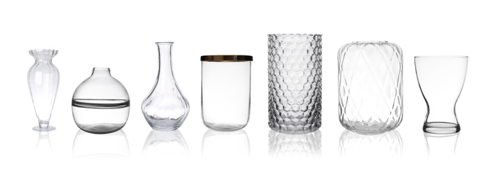 Image of Set of empty glass vases on white background. Banner design