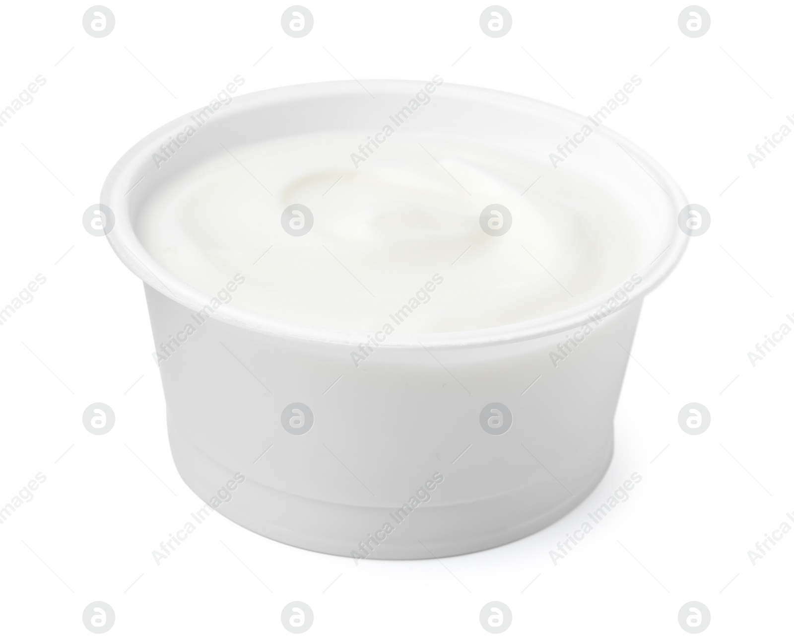 Photo of Delicious natural yogurt in plastic cup isolated on white