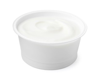 Photo of Delicious natural yogurt in plastic cup isolated on white