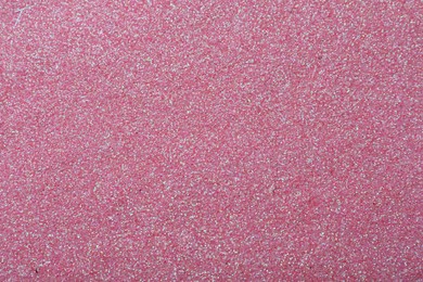 Photo of Beautiful shiny pink glitter as background, closeup