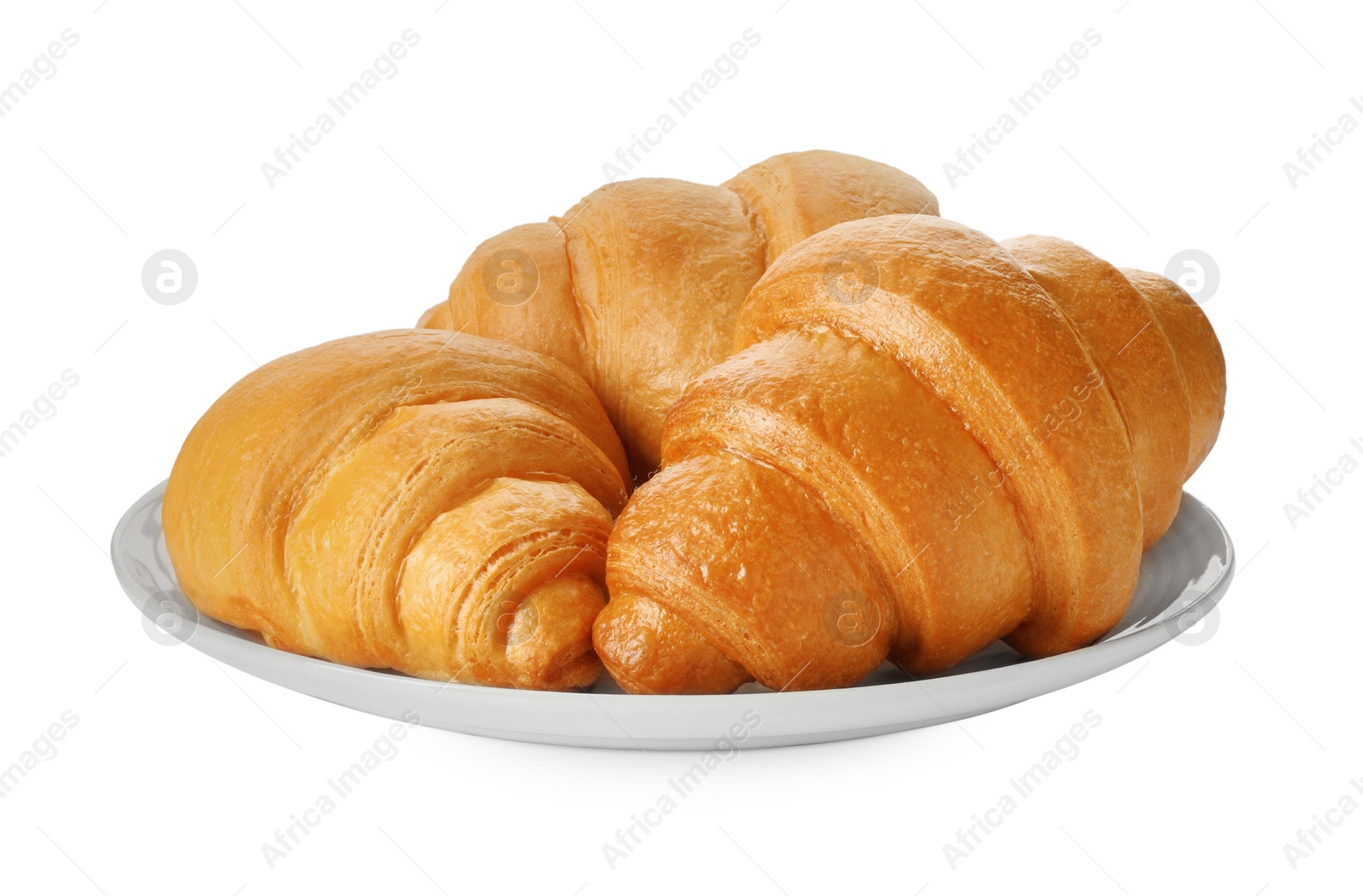 Photo of Plate with delicious fresh croissants isolated on white