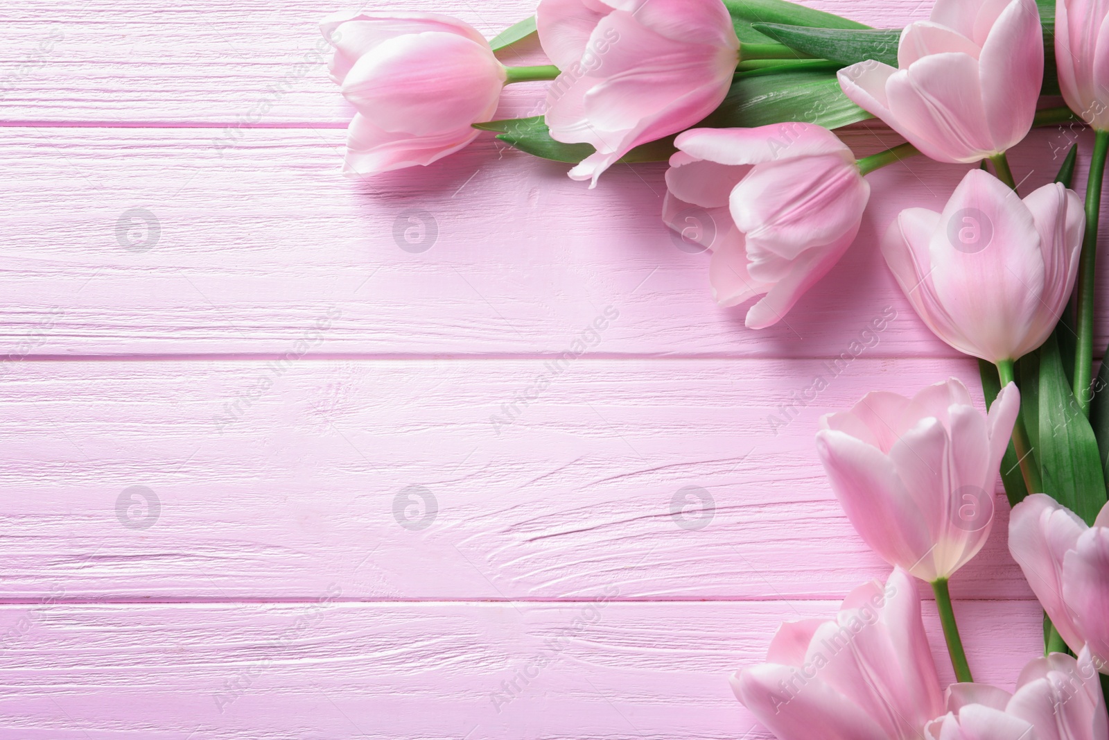 Photo of Beautiful composition with tulips for Mother's Day on wooden background