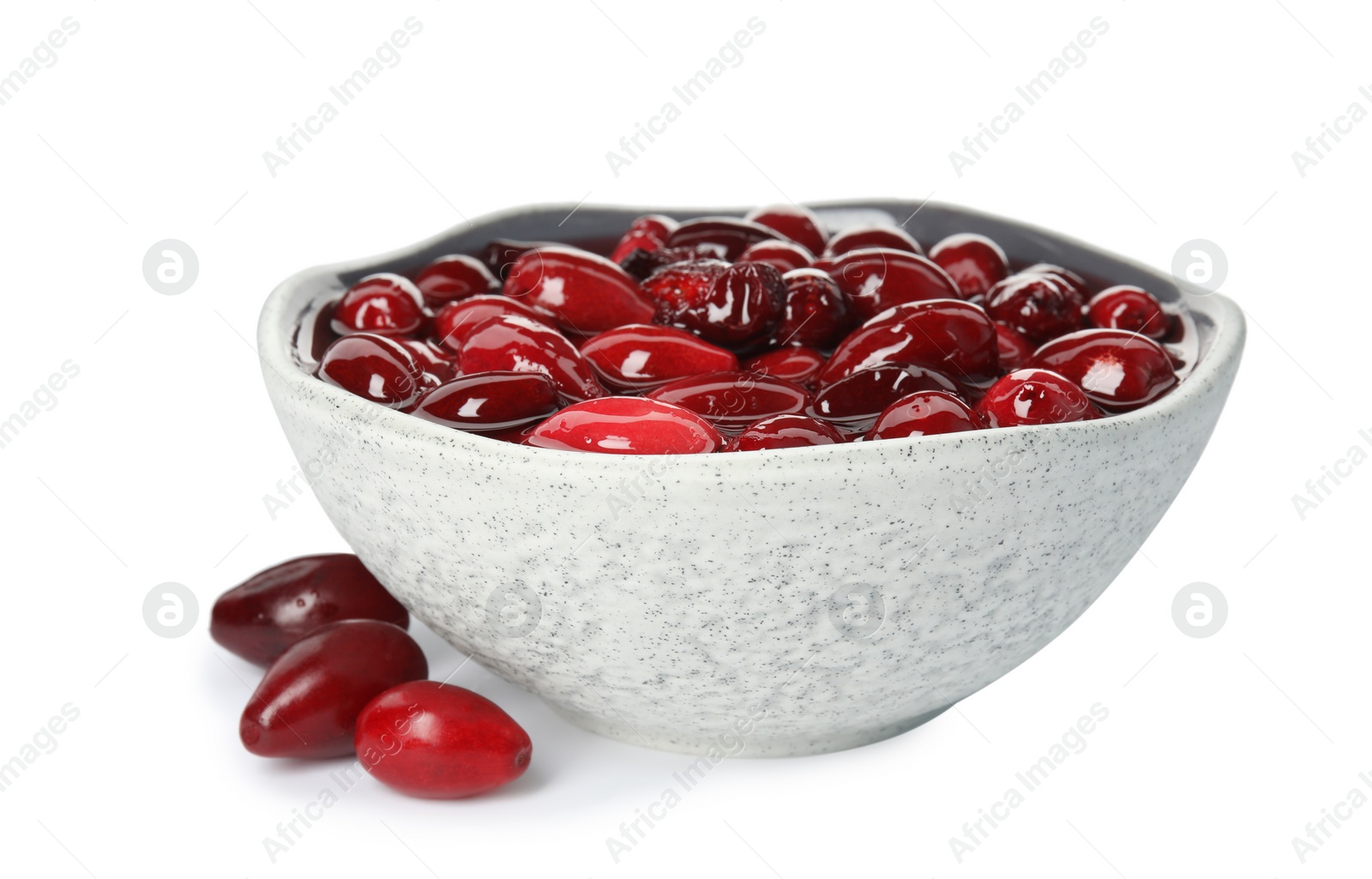 Photo of Delicious dogwood jam with berries and bowl on white background