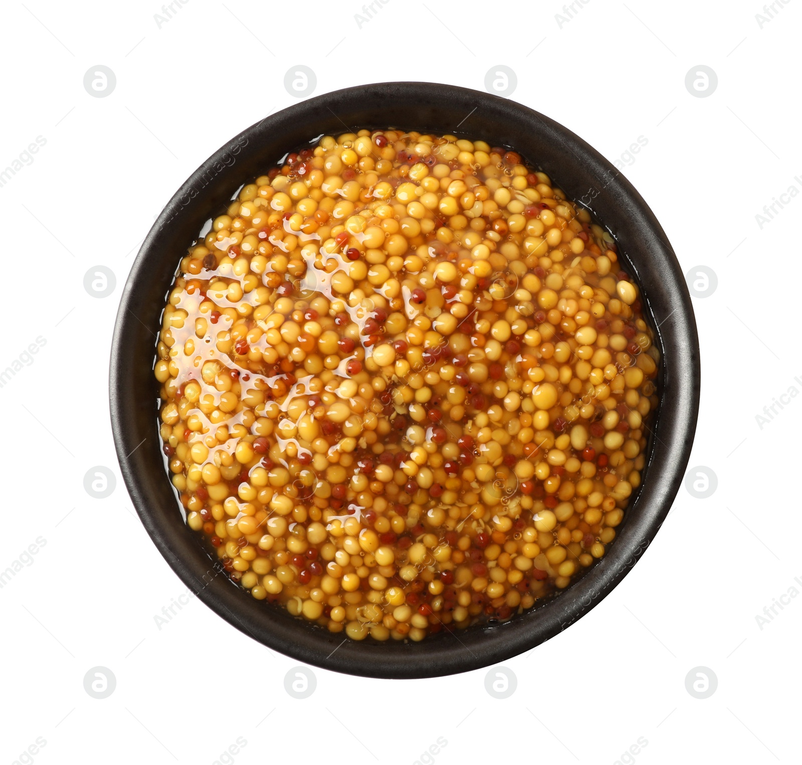 Photo of Bowl of whole grain mustard on white background, top view