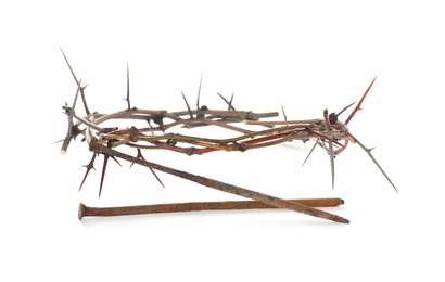 Photo of Crown of thorns and nails on white background. Easter attributes