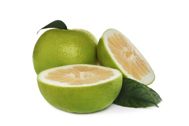 Photo of Whole and cut sweetie fruits with green leaves on white background