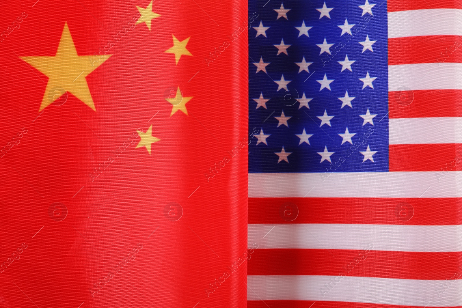 Photo of USA and China flags as background, top view. International relations