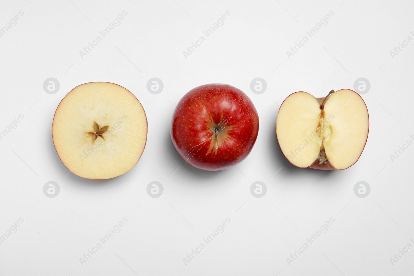 Photo of Ripe juicy red apples on white background, top view