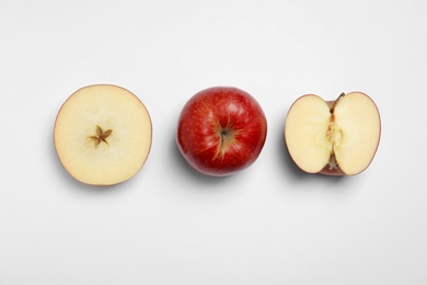 Photo of Ripe juicy red apples on white background, top view