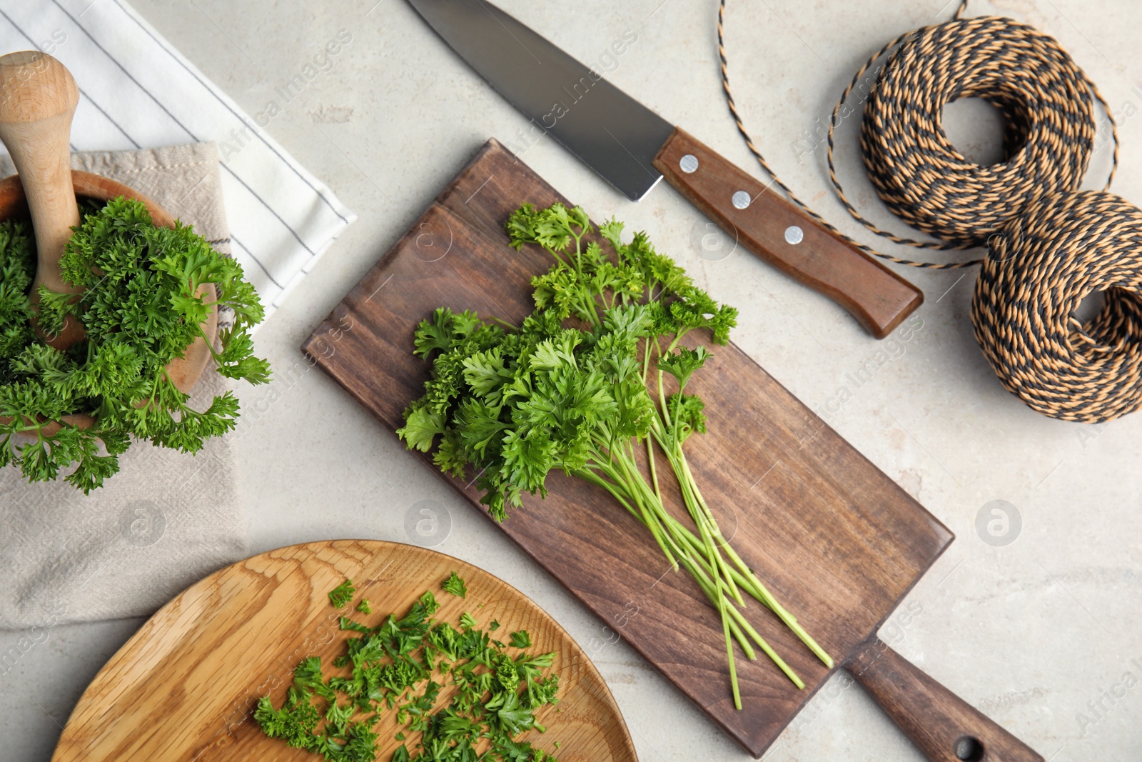 Photo of Flat lay composition with fresh green parsley on grey background