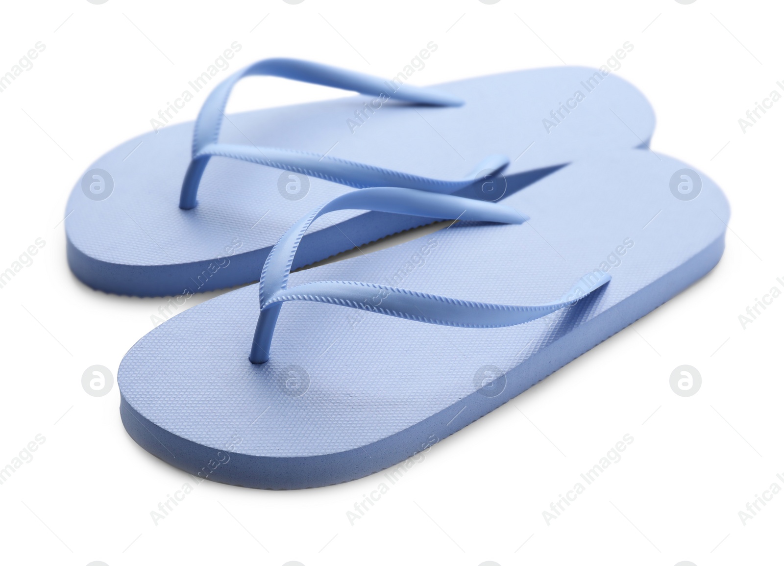 Photo of Stylish blue flip flops on white background. Beach object