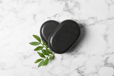 Photo of Flat lay composition with spa stones on marble background