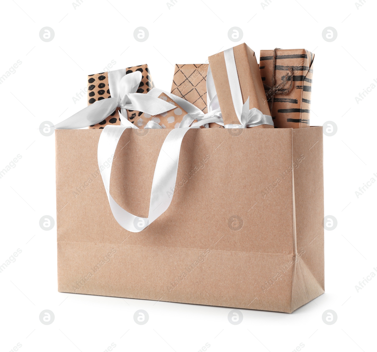 Photo of Paper shopping bag with handles full of gift boxes on white background. Mock up for design