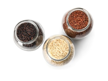 Photo of Jars with different types of rice on white background, top view