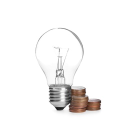 Lamp bulb and coins on white background. Money saving concept