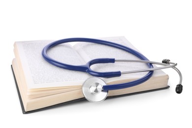 Photo of Open student textbook and stethoscope on white background. Medical education