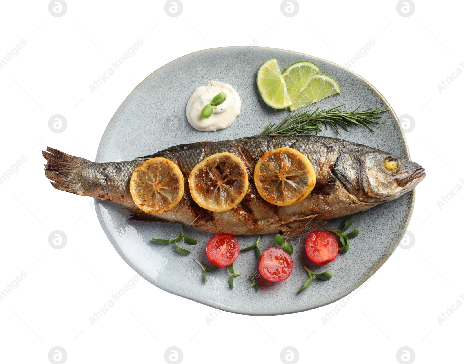 Photo of Plate with delicious baked sea bass fish and garnish on white background