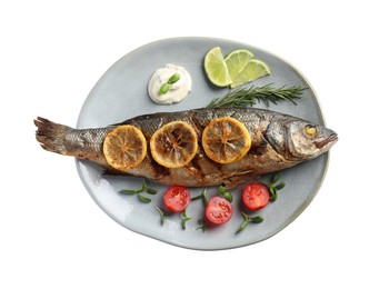 Photo of Plate with delicious baked sea bass fish and garnish on white background