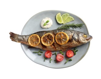 Plate with delicious baked sea bass fish and garnish on white background