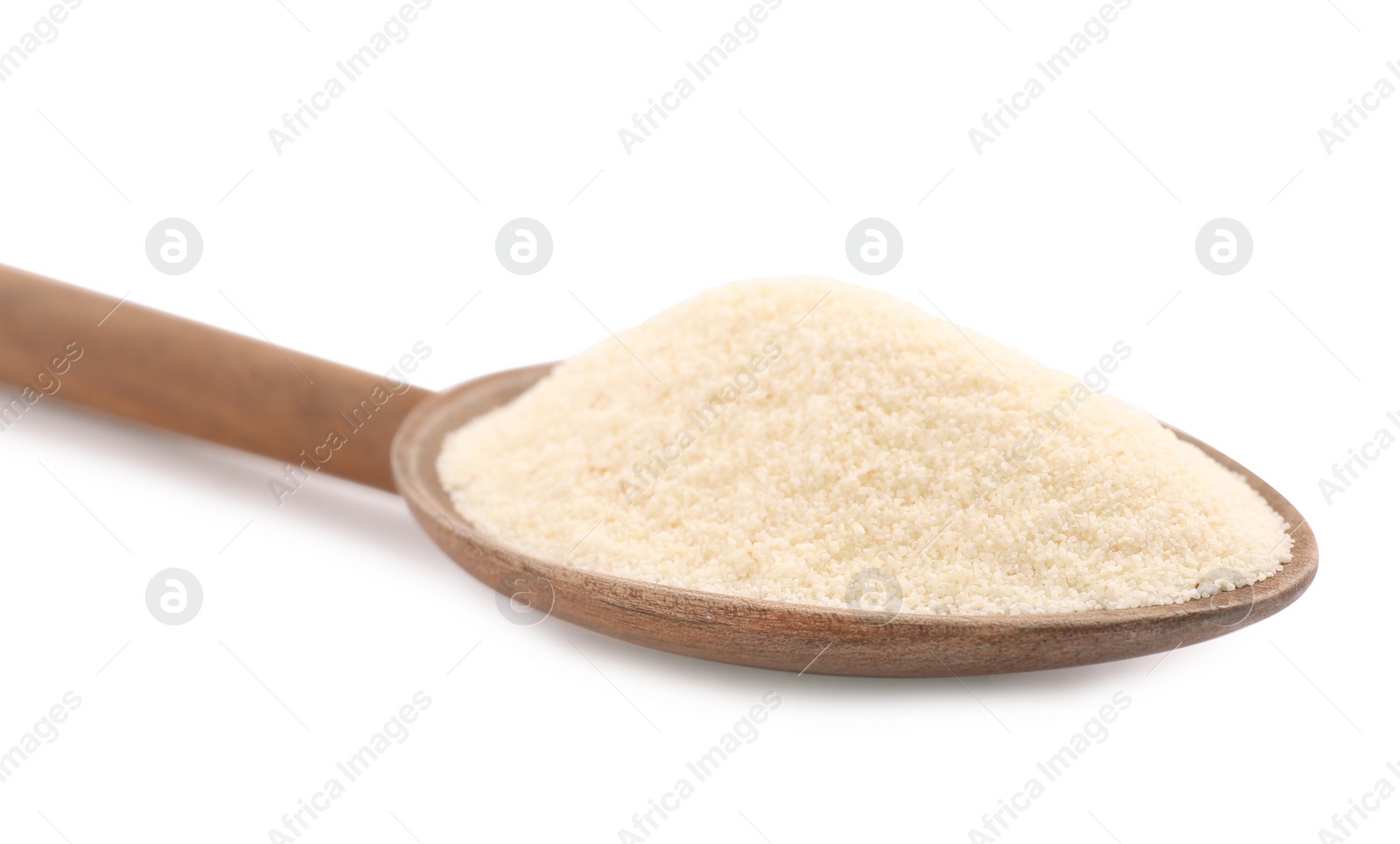 Photo of Spoon with organic semolina on white background, closeup