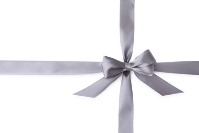 Grey satin ribbon with bow on white background, top view