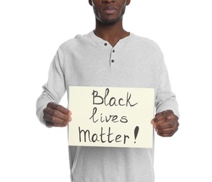 Photo of African American man holding sign with phrase Black Lives Matter on white background, closeup. Racism concept