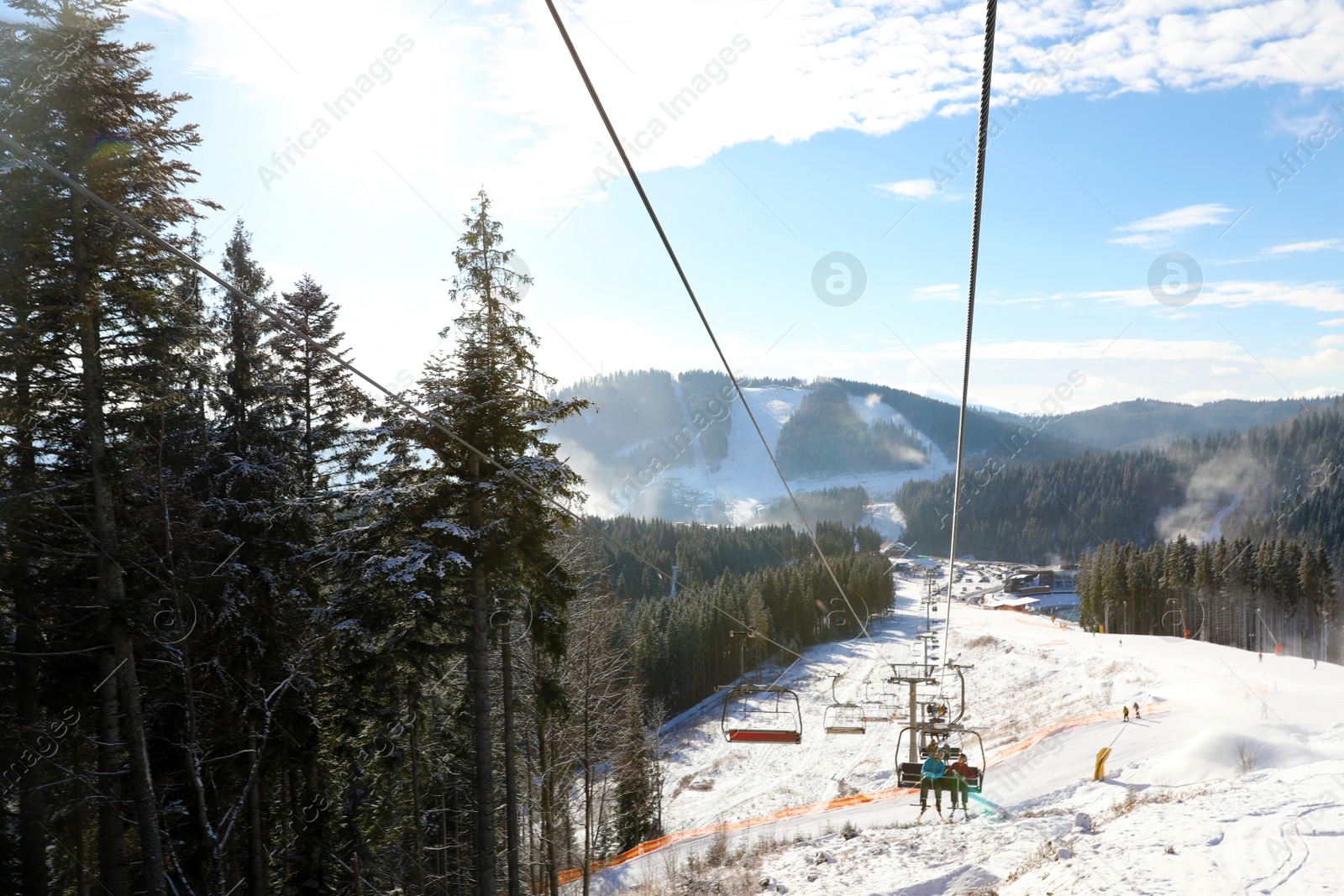 Photo of Beautiful mountain landscape with chairlift. Winter vacation