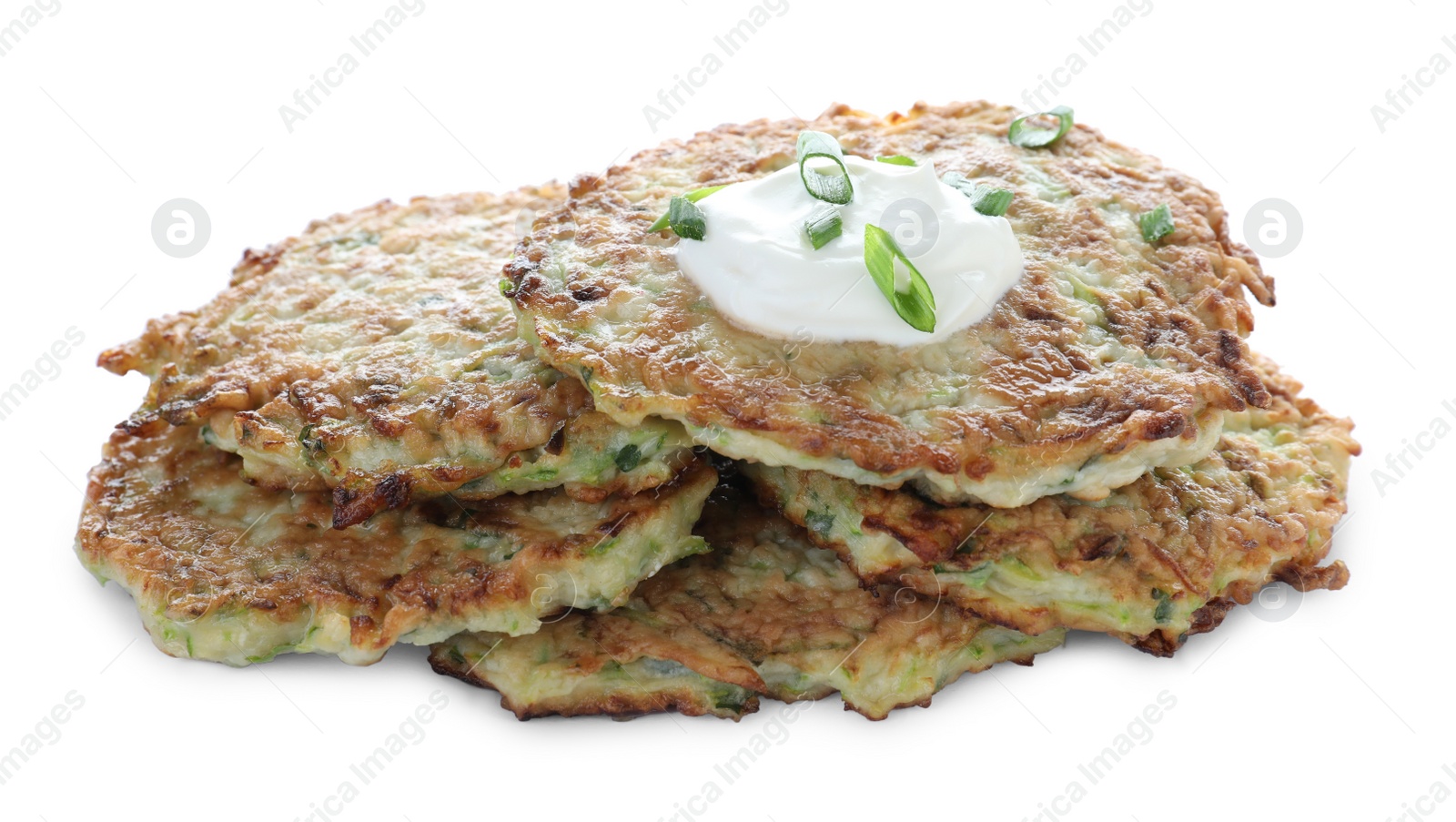 Photo of Delicious zucchini fritters with sour cream and green onion on white background
