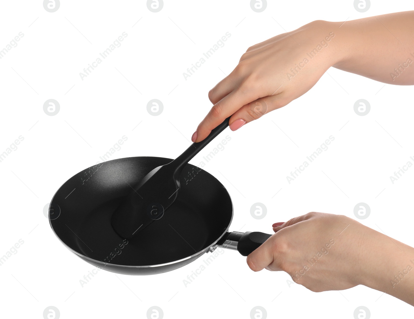 Photo of Woman with spatula and frying pan on white background, closeup