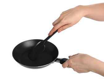 Photo of Woman with spatula and frying pan on white background, closeup