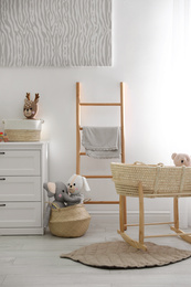 Photo of Cute children's room interior with wooden decorative ladder