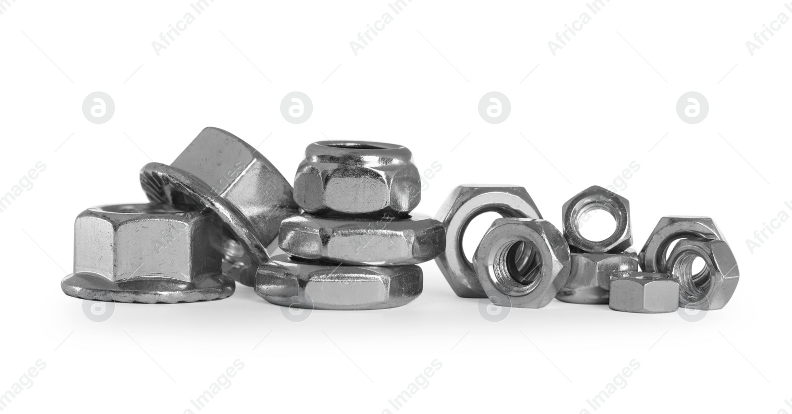 Photo of Many different metal nuts on white background