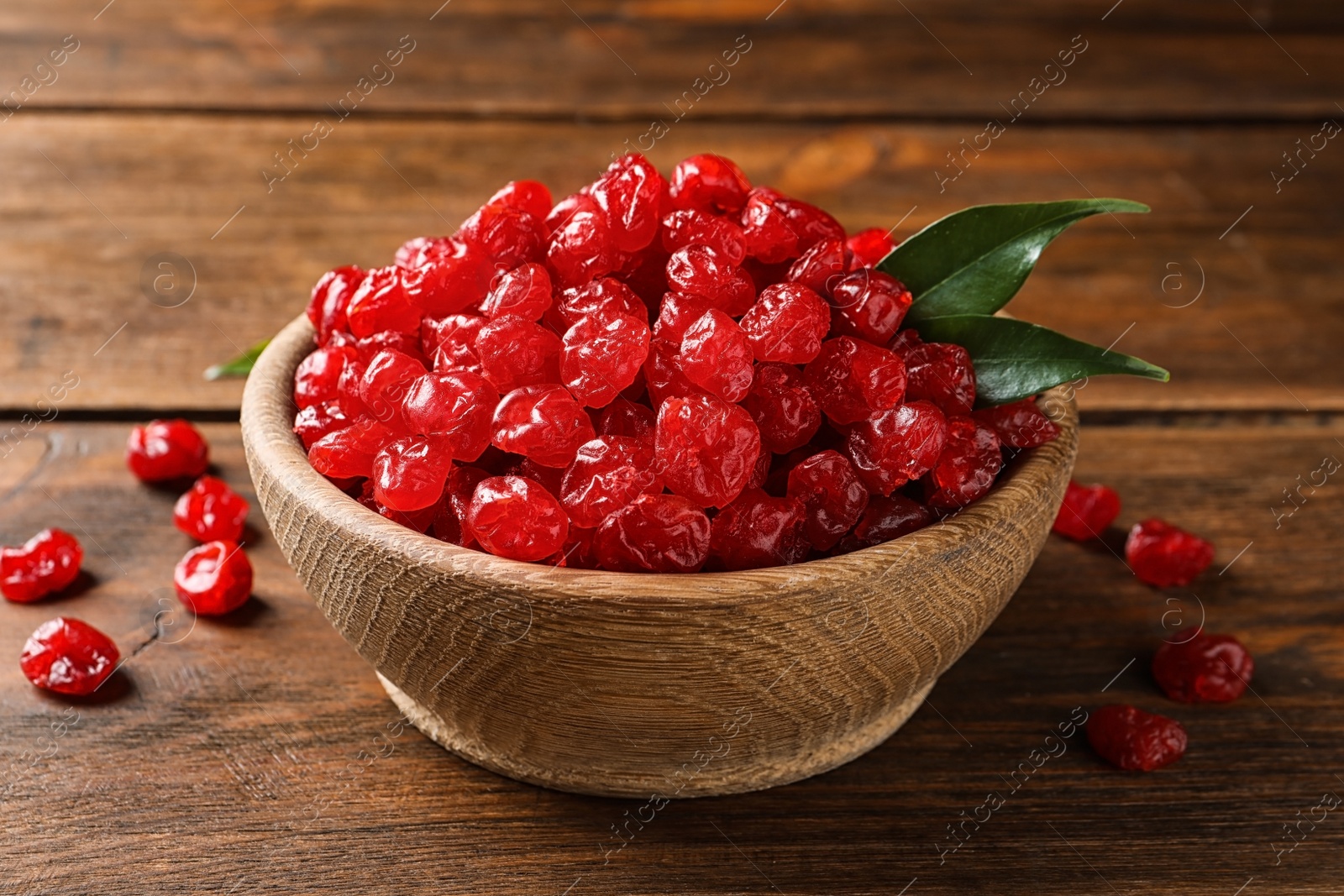Photo of Bowl with tasty cherries on wooden background. Dried fruits as healthy food