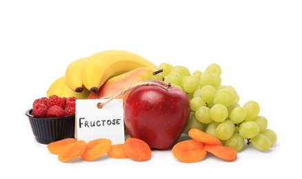 Photo of Card with word Fructose, delicious ripe fruits, raspberries and dried apricots isolated on white