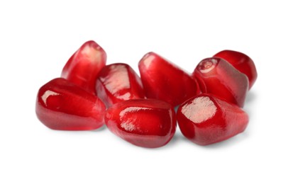Tasty juicy pomegranate seeds on white background