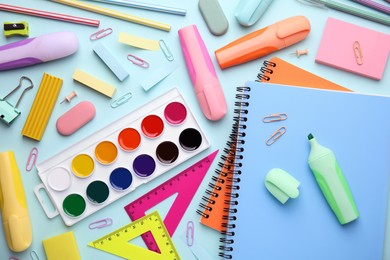 Photo of Different school stationery on light background, flat lay. Back to school