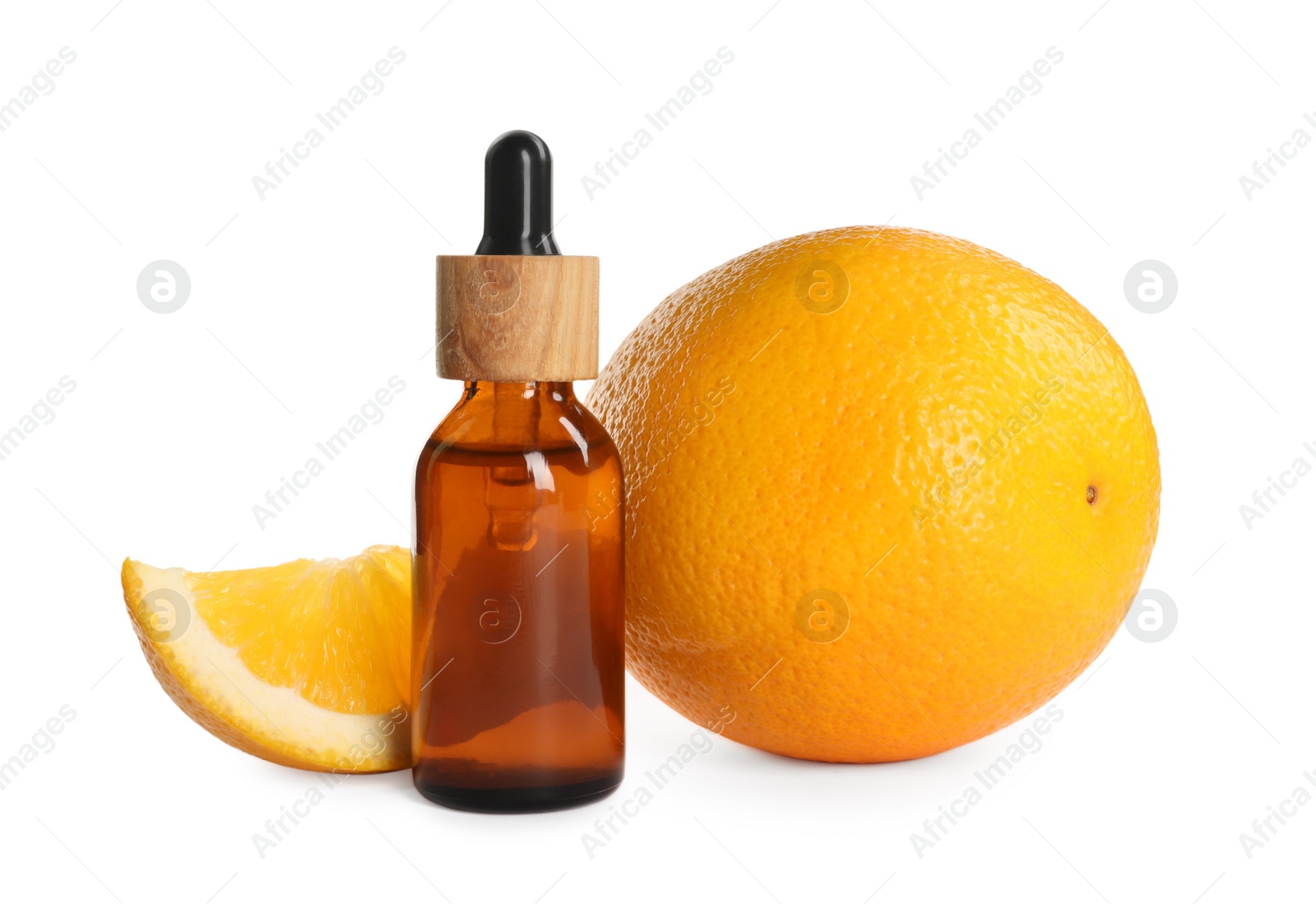 Photo of Bottle of citrus essential oil and fresh oranges on white background