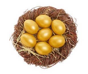 Photo of Shiny golden eggs in nest on white background, top view