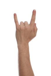 Photo of Man showing rock gesture against white background, closeup of hand