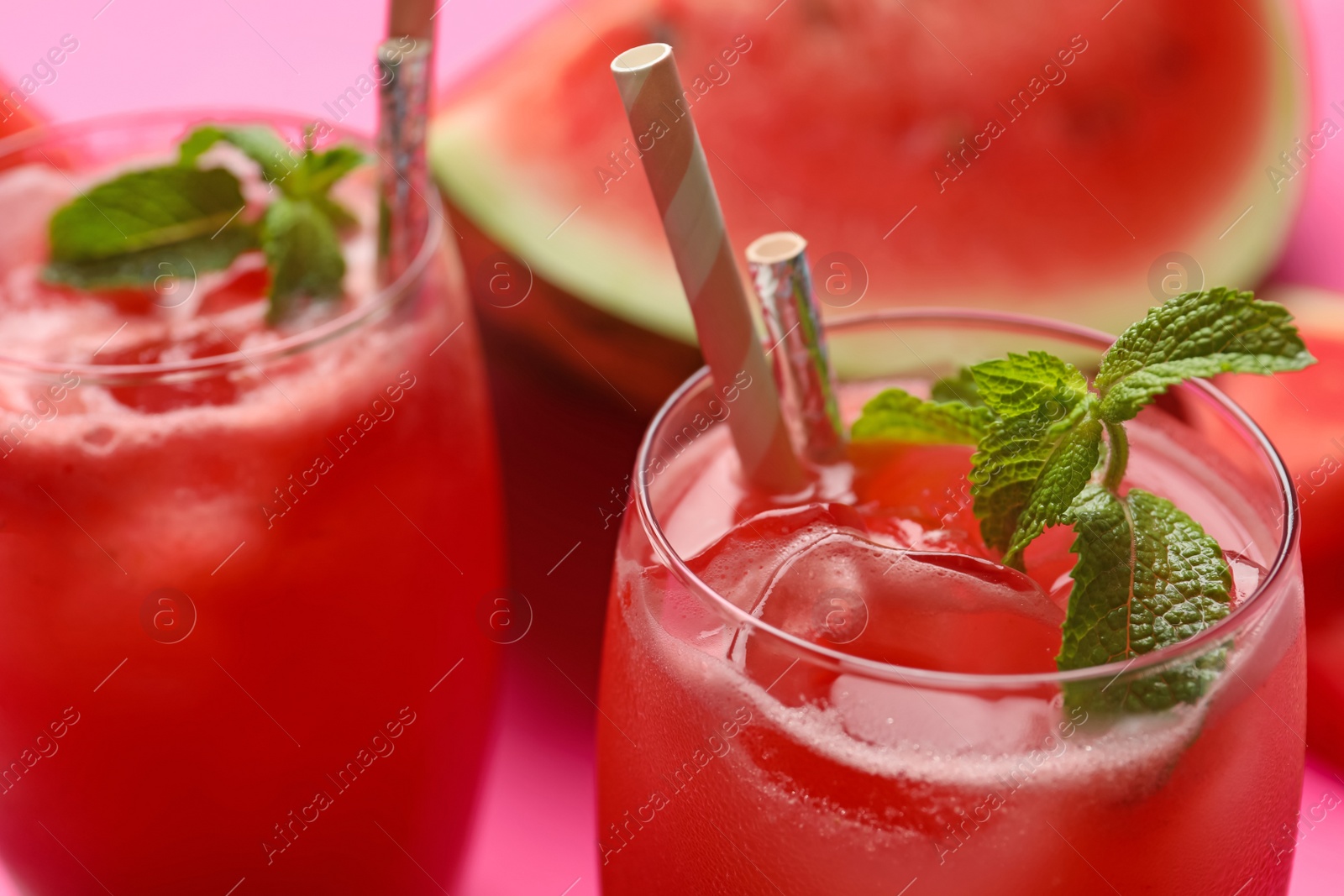 Photo of Tasty watermelon drink with mint in glass, closeup