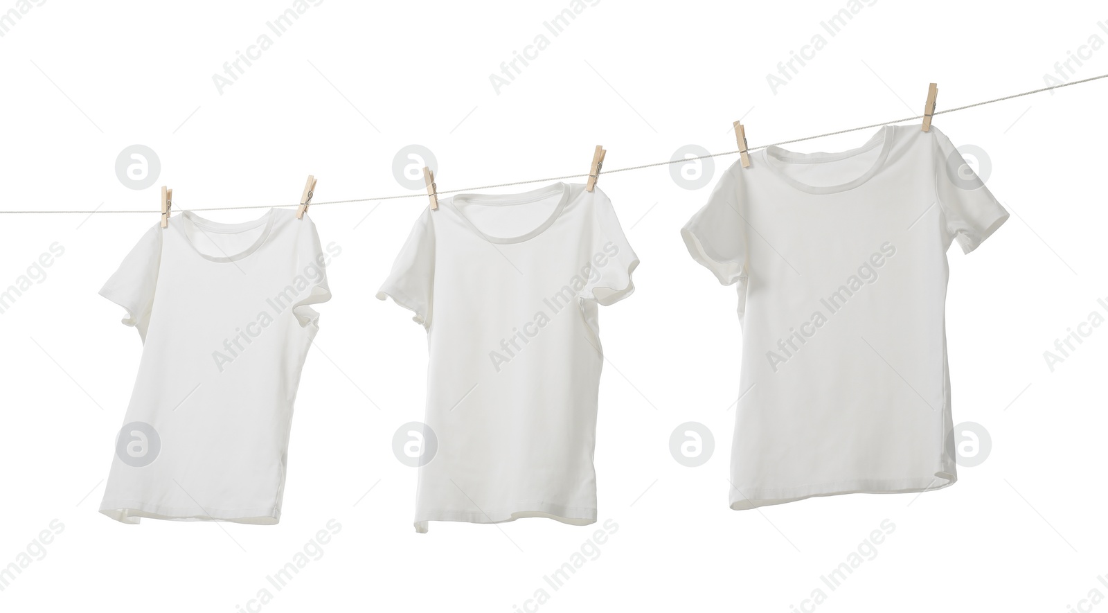 Photo of Many t-shirts drying on washing line isolated on white