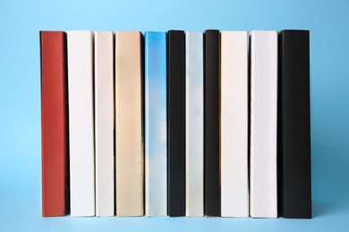 Photo of Collection of books on light blue background