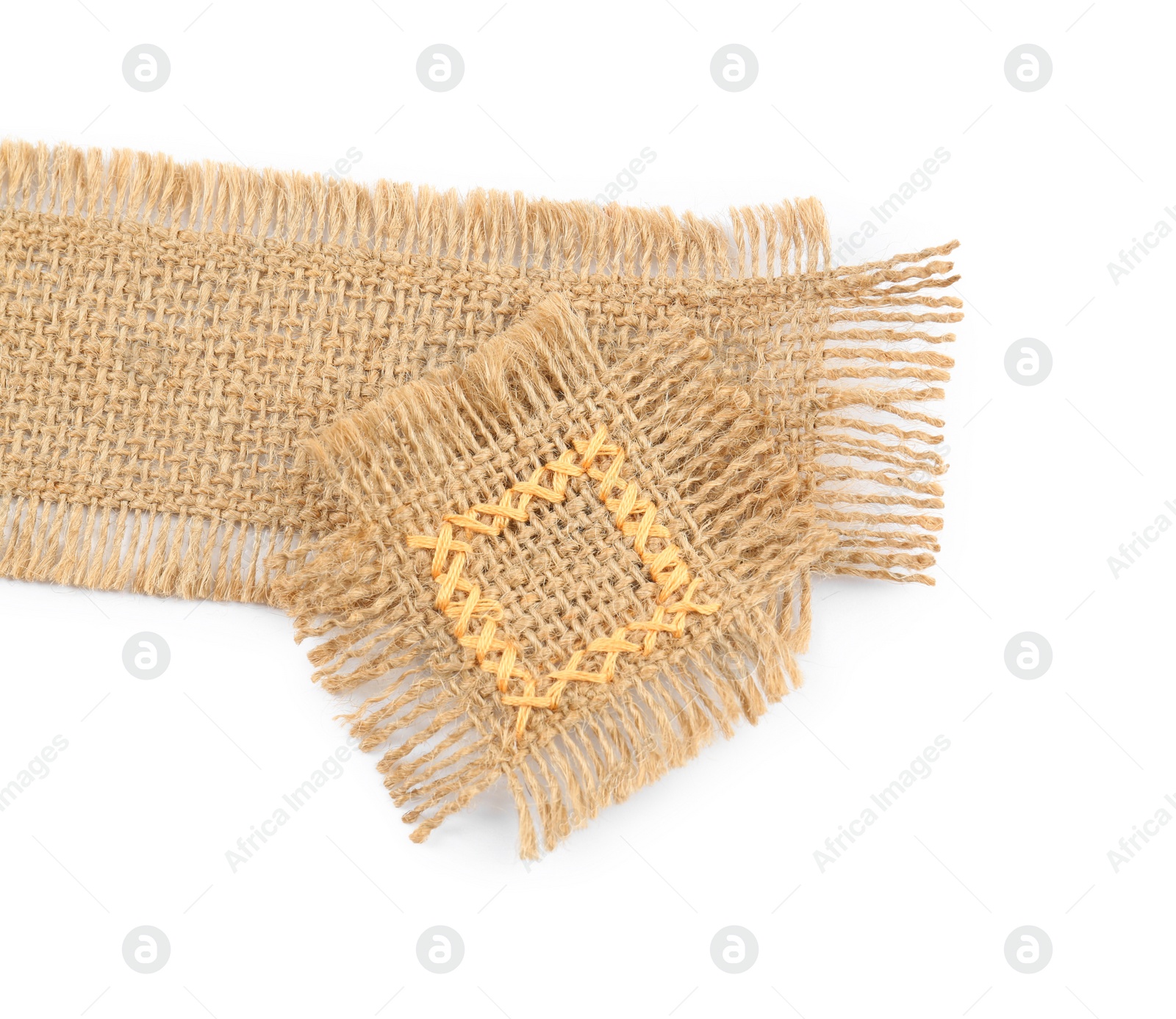 Photo of Pieces of burlap fabric on white background, top view