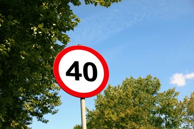 Image of Road sign Maximum speed limit against blue sky