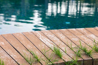 Photo of Outdoor swimming pool with wooden deck at resort