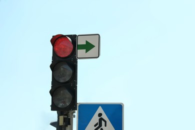 Photo of View of traffic light against blue sky, space for text